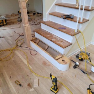 Removed old railing and installed new custom railings, with an additional new dark stain finish in Manalapan NJ